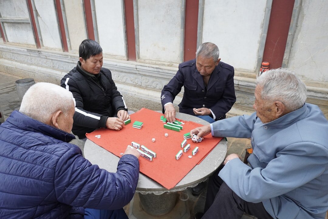 group of seniors playing cards