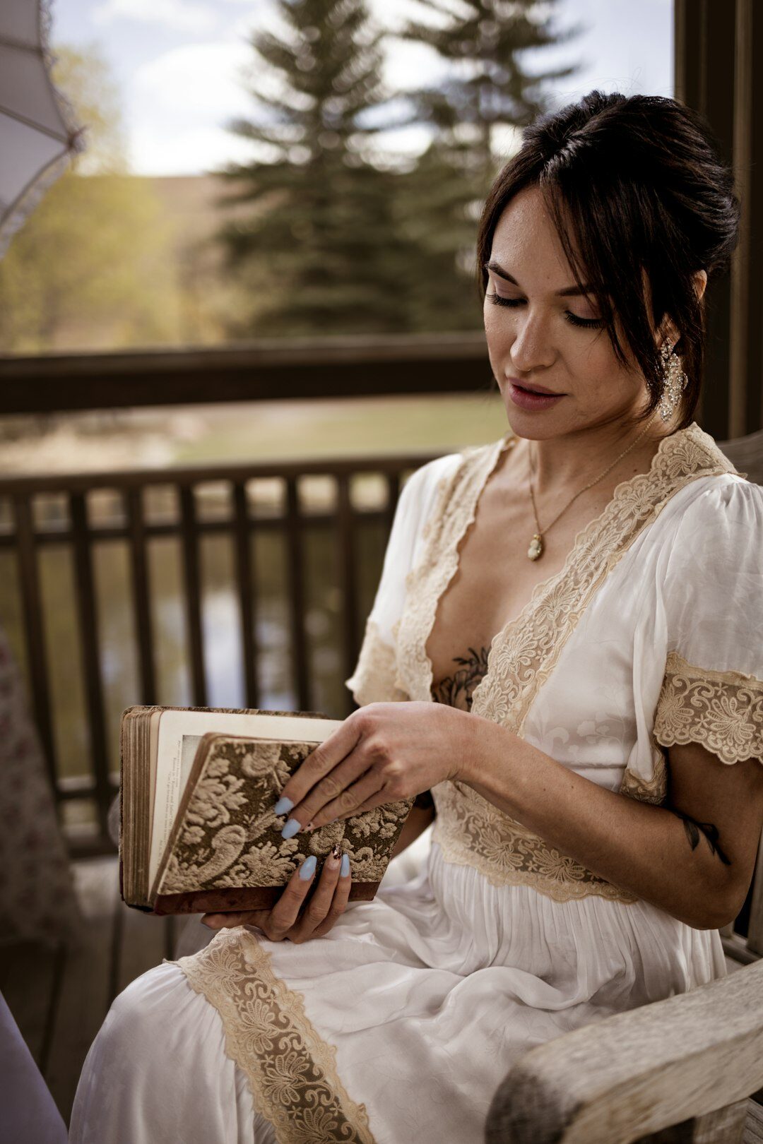 senior reading book on porch